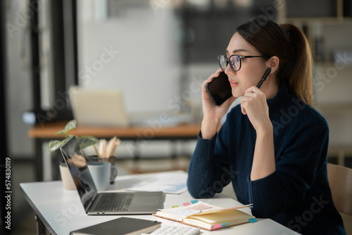 Asian businesswoman sitting and working at office