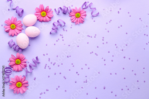 Composition with Easter eggs, confetti and chrysanthemum flowers on color background