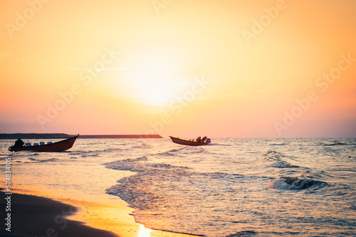 Panoramic view beautiful romantic sunset in Bandar Anzali on caspian sea coast photo