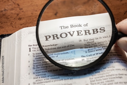 title page book of Proverbs close up using magnifying glass in the bible or Torah for faith, christian, hebrew, israelite, history, religion, christianity, Old Testament photo