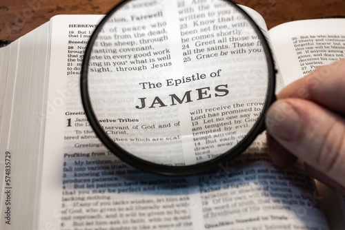 title page book of James close up using magnifying glass in the bible for faith, christian, hebrew, israelite, history, religion, christianity, new testament