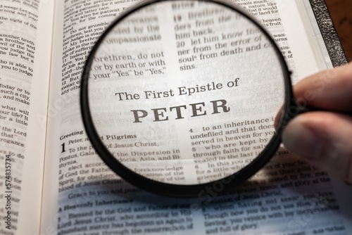 title page book of first peter close up using magnifying glass in the bible for faith, christian, hebrew, israelite, history, religion, christianity, new testament