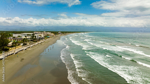 Canvas Print Aerial view of coast with hotels and tourists, a famous place for surfing in the Philippines