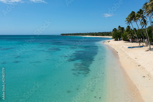 Fototapeta Naklejka Na Ścianę i Meble -  Tropical sandy beach and blue sea. Tropical beach scenery. Pagudpud, Ilocos Norte Philippines