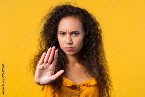 Uninterested woman disapproving with NO hand sign gesture. Denying  rejecting