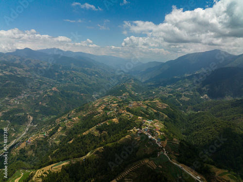 Aerial drone of agricultural plantations and rice terraces on hillsides in a mountainous area. Philippines, Luzon.