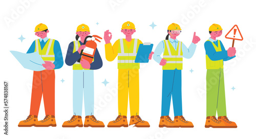 Construction workers are posing to emphasize safety. They stand with safety related items in their hands.