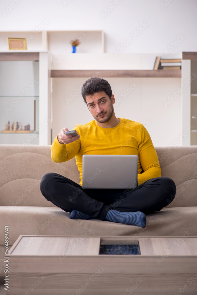 Young male freelancer working from home during pandemic Young male freelancer working from home during pandemic