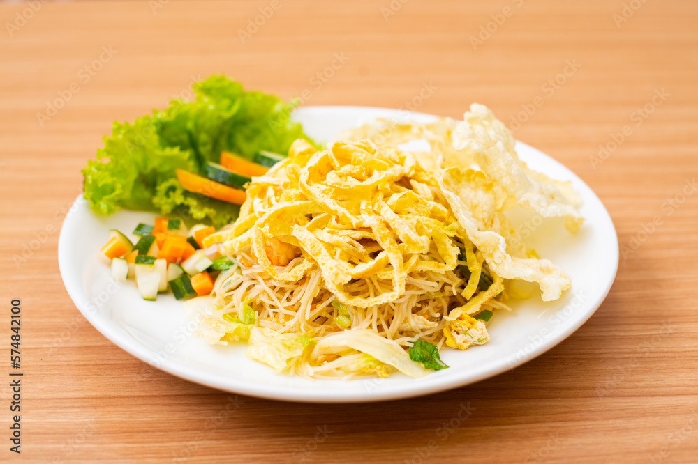 Indonesian Fried Noodles topped with shredded egg on top Indonesian Fried Noodles topped with shredded egg on top