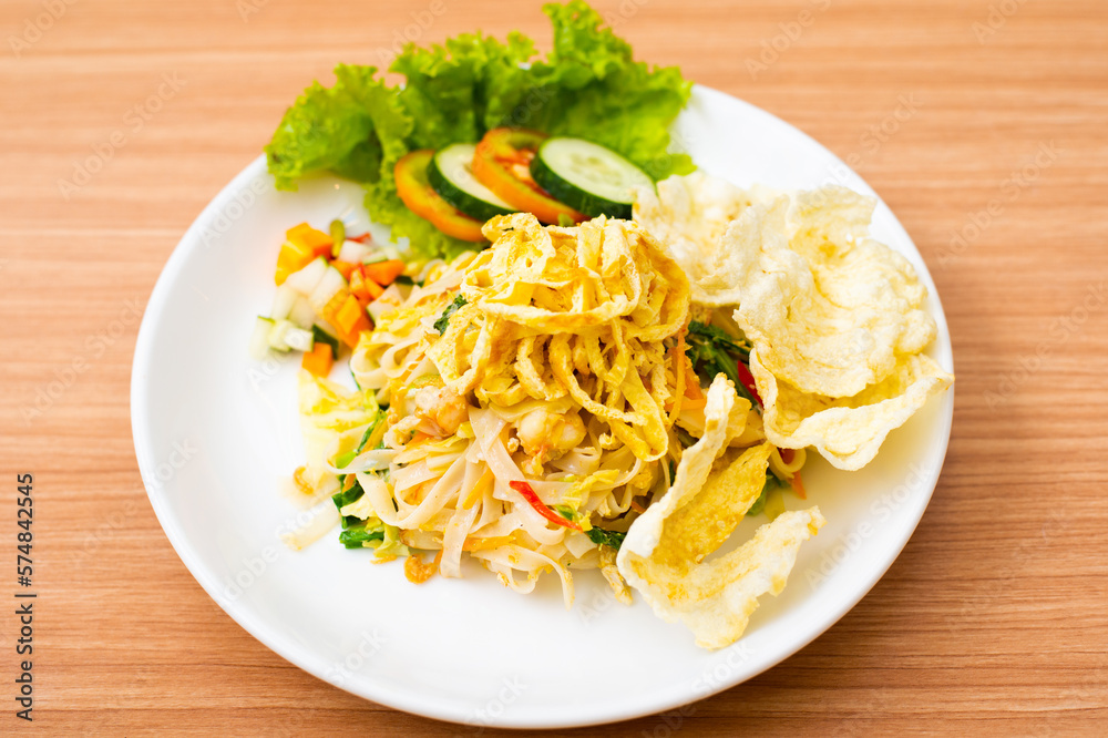 Indonesian Fried Noodles topped with shredded egg on top Indonesian Fried Noodles topped with shredded egg on top