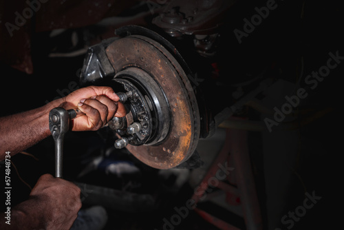 Car Machanic checking and maintenance on the car in the garage. Car repair and maintenanc concept.