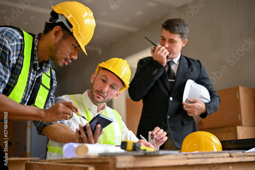 Team of construction engineer and businessman working together in the construction site