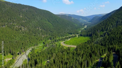 Aerial drone footage of a Romanian mountain road – Transalpina. It is a 148 km national road located in the Southern Carpathians of Romania and is one of the highest roads of the Carpathian Mountains. photo