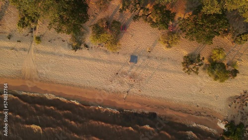 Orbit Shot Of Friends Playing Beach Volley On Fray Bentos Coast, Uruguay photo