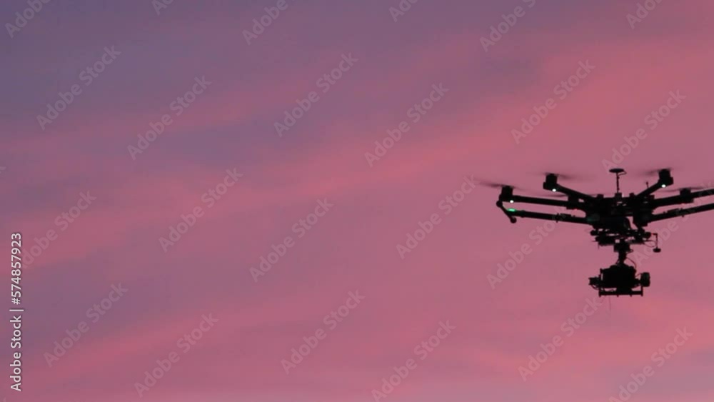 DJI S900 Mega drone flying with pink sunset in background DJI S900 Mega drone flying with pink sunset in background