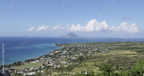 View of Sandy Point Town, St. Kitts with Sint Eustatius Island in the distance. Sandy Point is the second largest town, with a population of nearly 3,000, on the island of Saint Kitts