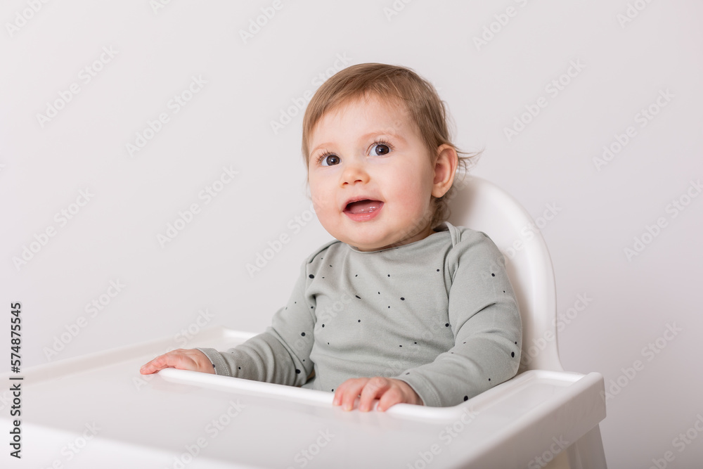 cute baby sitting in high chair, card, banner, space for text