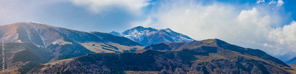 Panorama view of mountains covered with snow in Kyrgyzstan