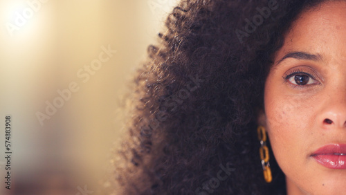 Copy space of brown eye on child psychologist looking forward with an intense and serious stare while thinking of past trauma remedy. Closeup face and portrait of worried afro healthcare professional