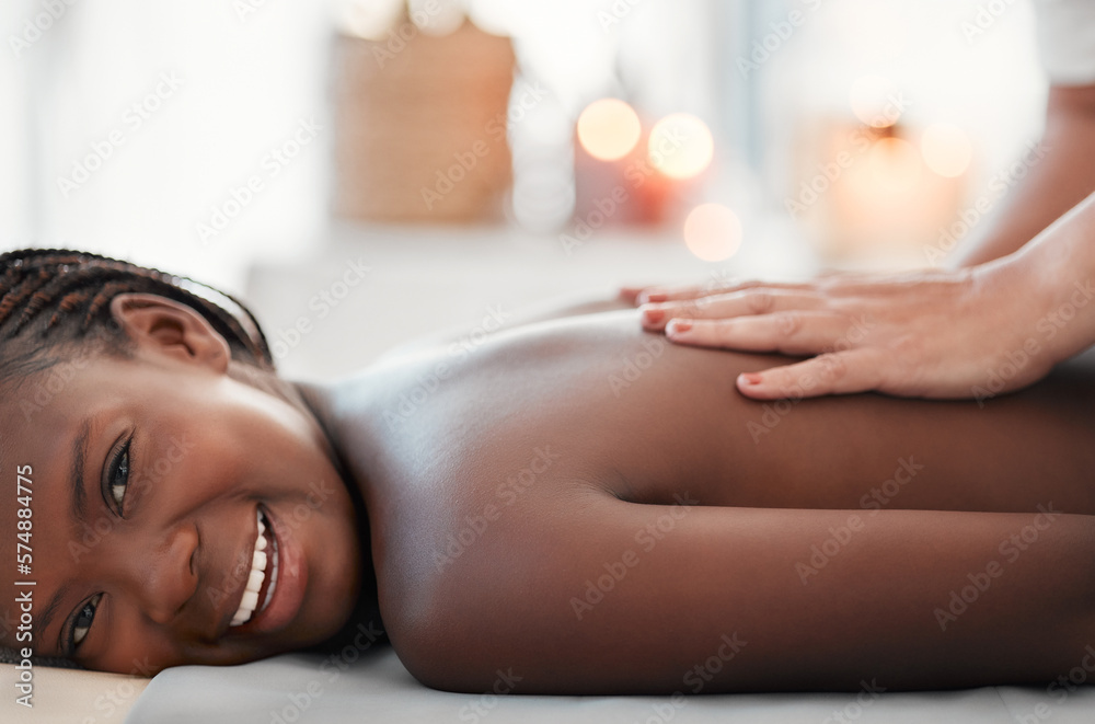 Black woman, smile and back massage at spa in relax for physical therapy,  zen or stress