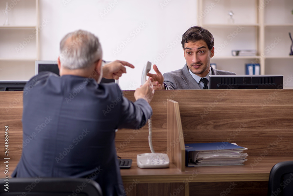 Two male colleagues working in the office Two male colleagues working in the office