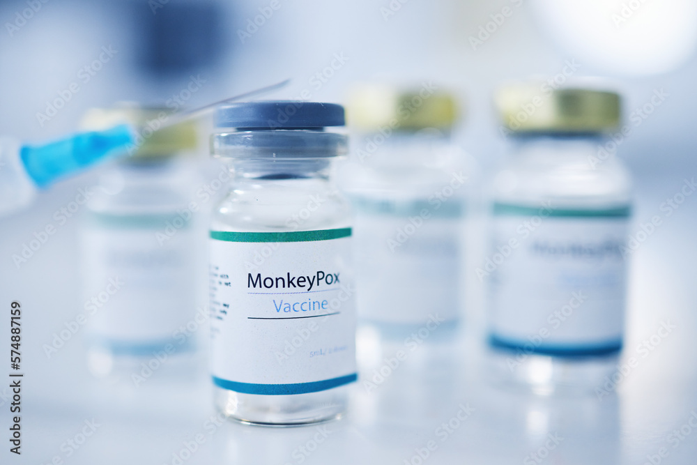 Monkeypox vaccine, backgrounds and injection vial for medicine, safety and healthcare risk. Closeup, liquid bottle and virus vaccination of medical drugs, wellness and pharmaceutical science research