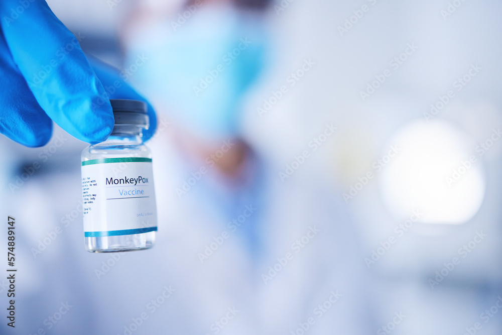 Monkeypox vaccine, doctor and hands of vial for risk, protection and healthcare medicine. Closeup, liquid bottle and vaccination of virus, medical drugs or mockup in pharmaceutical science laboratory