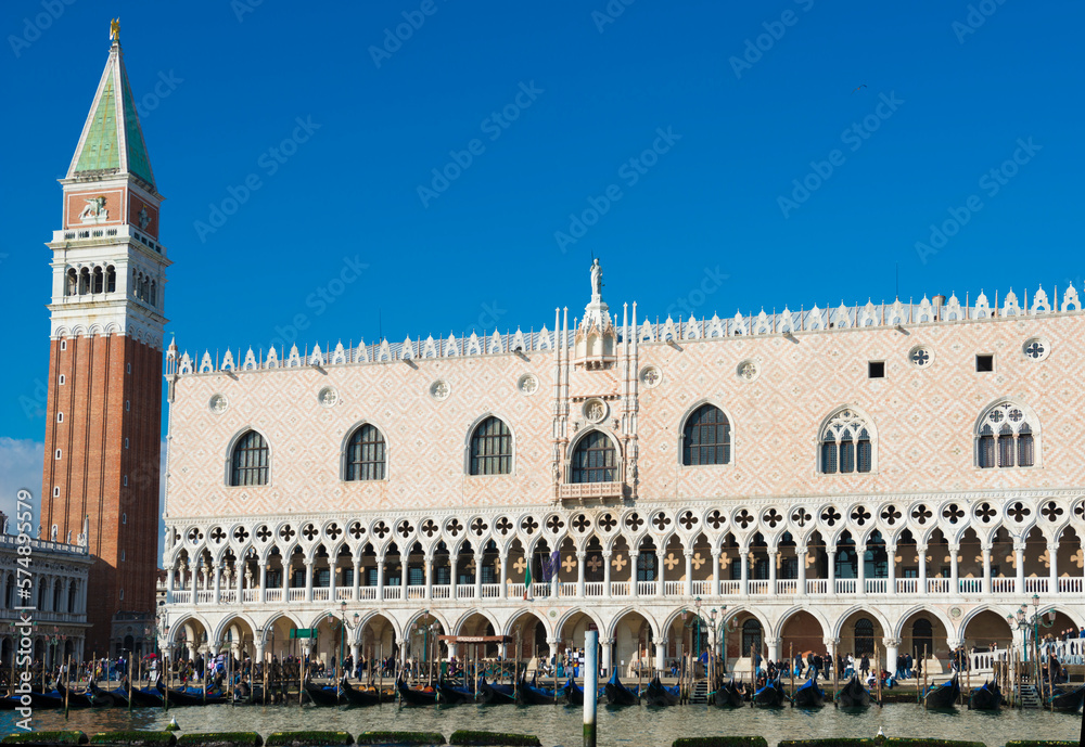 Doge's Palace with Bell Tower and Gondola in St. Mark's Square in a Sunny Day in Venice, Veneto in Italy.