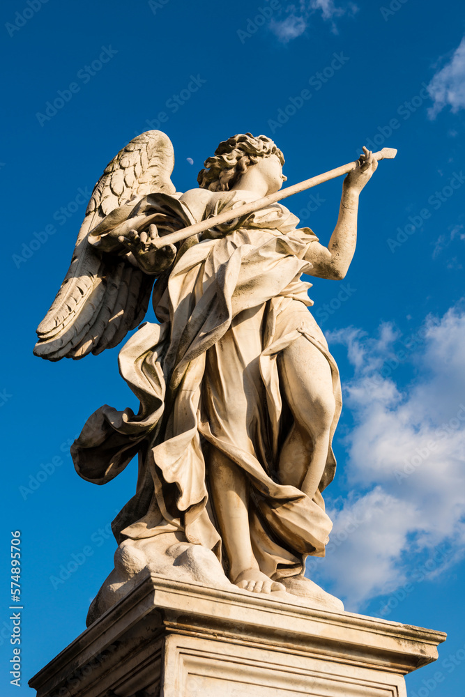 Beautiful Angel Statue on Bridge Sant'angelo Against Blue Sky and the Moon in Rome, Lazio in Itay.