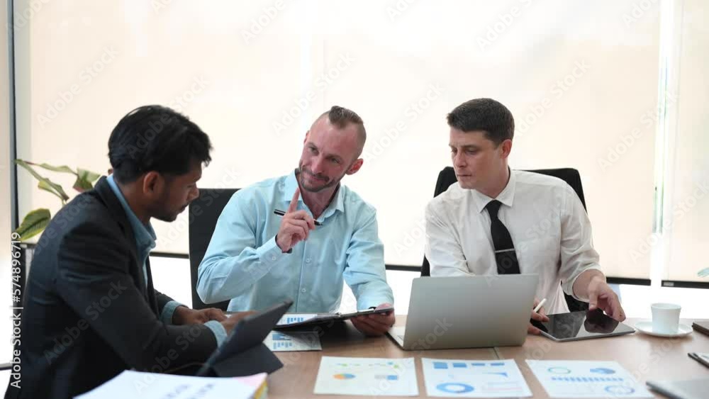 Office colleagues have a casual discussion. During a meeting in a conference room, a group of business teem sit in the conference room . Office colleagues have a casual discussion. During a meeting in a conference room, a group of business teem sit in the conference room .