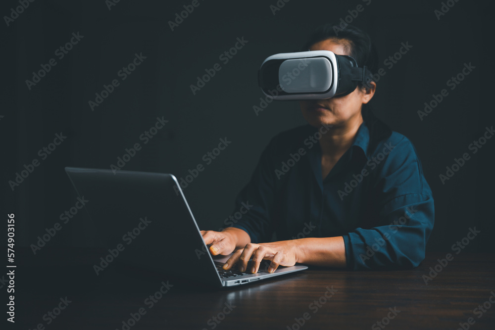Woman with glasses of virtual reality. Future technology concept. Metaverse technology concept. VR virtual reality goggles. Futuristic lifestyle. female using virtual reality headset at home office. Woman with glasses of virtual reality. Future technology concept. Metaverse technology concept. VR virtual reality goggles. Futuristic lifestyle. female using virtual reality headset at home office.