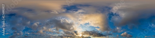 Dark blue sunset sky panorama with golden Cumulus clouds. Seamless hdr 360 panorama in spherical equirectangular format. Full zenith for 3D visualization  sky replacement for aerial drone panoramas.