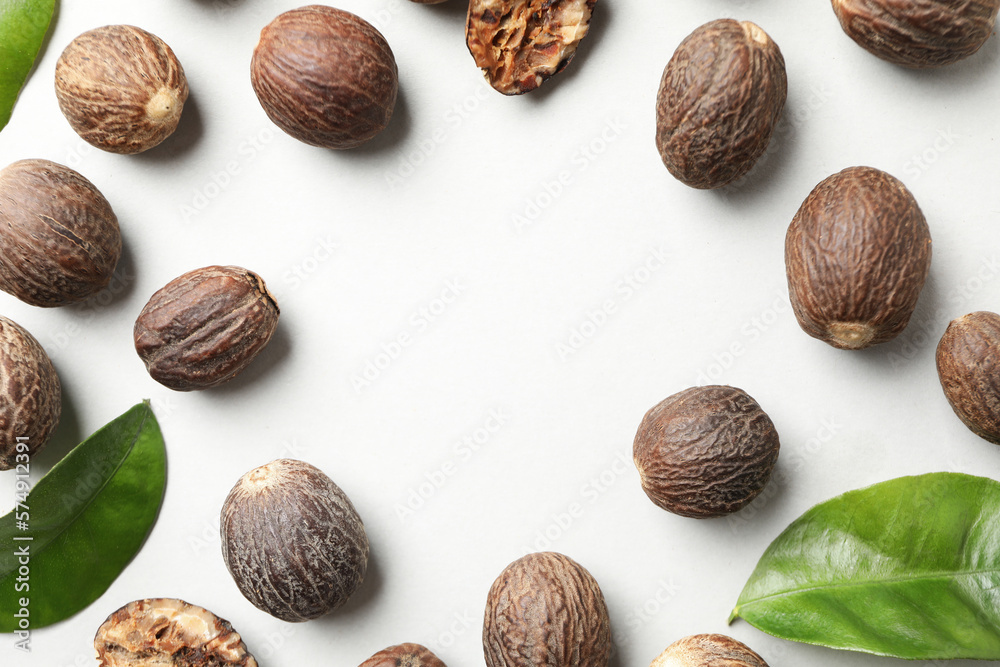 Concept of spices and condiments, nutmegs, space for text Concept of spices and condiments, nutmegs, space for text