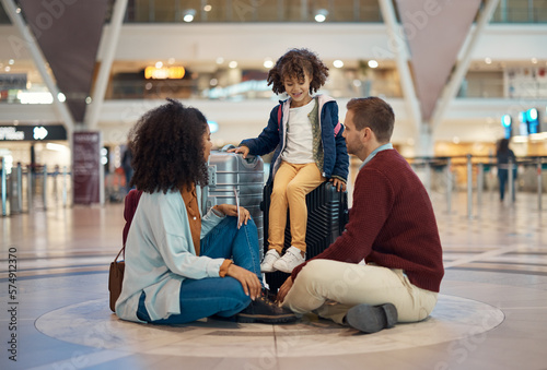 Family at airport, travel and waiting with luggage, mother and father with child, relax with flight delay and adventure. Terminal, journey and holiday with black woman, man and kid with suitcase