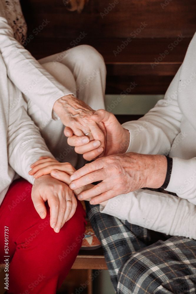 A large photo of the hands of an elderly married couple 4463.