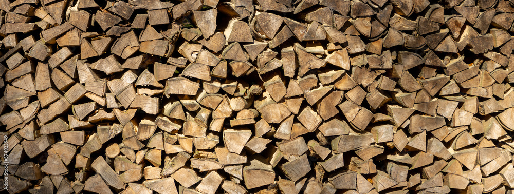 Stack of chopped firewood for wooden background Stack of chopped firewood for wooden background
