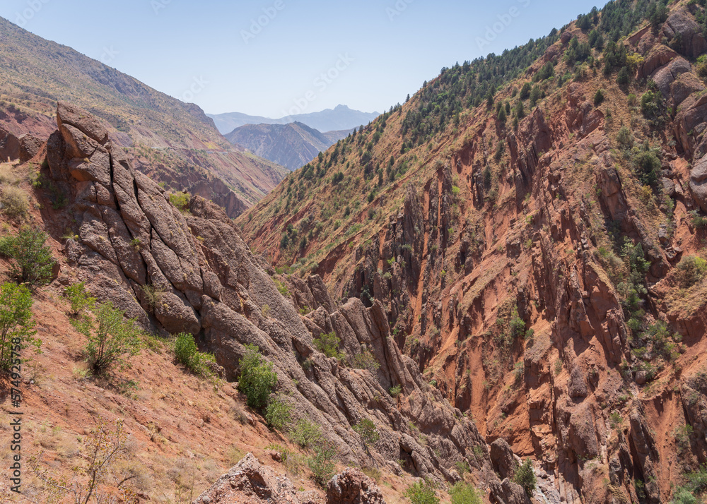 Scenic landscape view of spectacular orange red rocky valley between Shurobod pass and Panj valley, Khatlon, Tajikistan