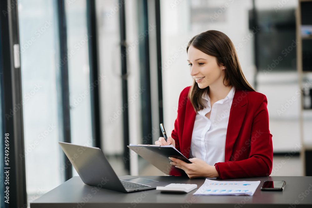 female office businesswoman startup daydreaming about her work, startup and working with laptop on office desk in office room female office businesswoman startup daydreaming about her work, startup and working with laptop on office desk in office room