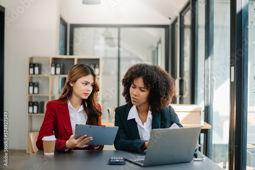 Team thinking of problem solution at office meeting, sad diverse business people group shocked by bad news, upset colleagues in panic after company