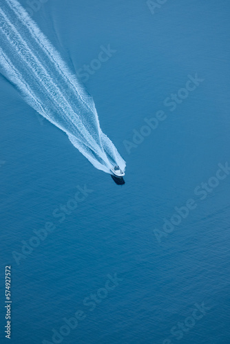 Aerial View of a High-Powered Speedboat Cutting Through the Waves photo