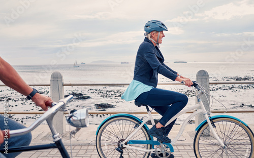 Photographie Old woman on bike at beach, fitness and cycling outdoor, vitality and health, retirement activity by ocean