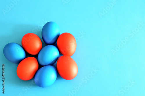 A blue background with red and blue easter eggs on it
