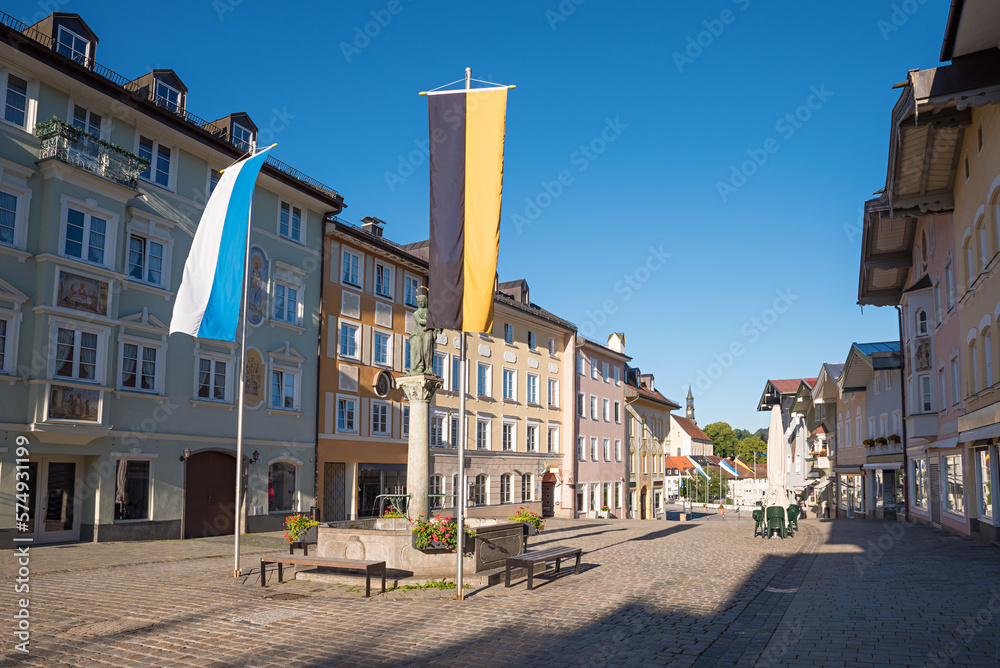 historic old town Bad Tolz, pedestrian zone with beautiful houses and bavarian flags