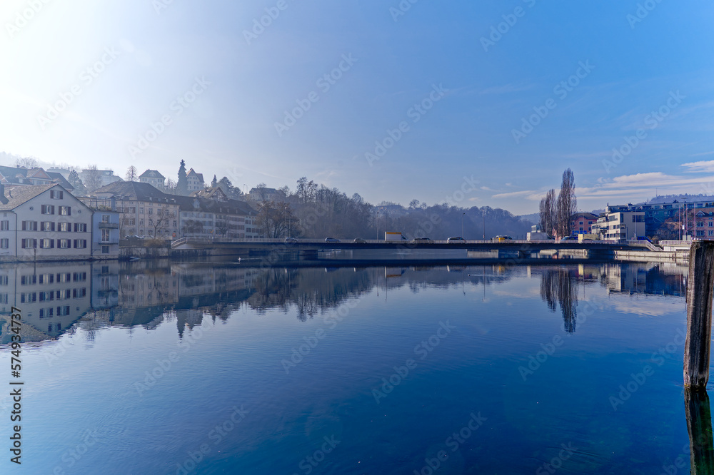 Scenic view of Rhine River at Swiss City of Schaffhausen with car bridge on a sunny winter day. Photo taken February 16th, 2023, Schaffhausen, Switzerland. Scenic view of Rhine River at Swiss City of Schaffhausen with car bridge on a sunny winter day. Photo taken February 16th, 2023, Schaffhausen, Switzerland.