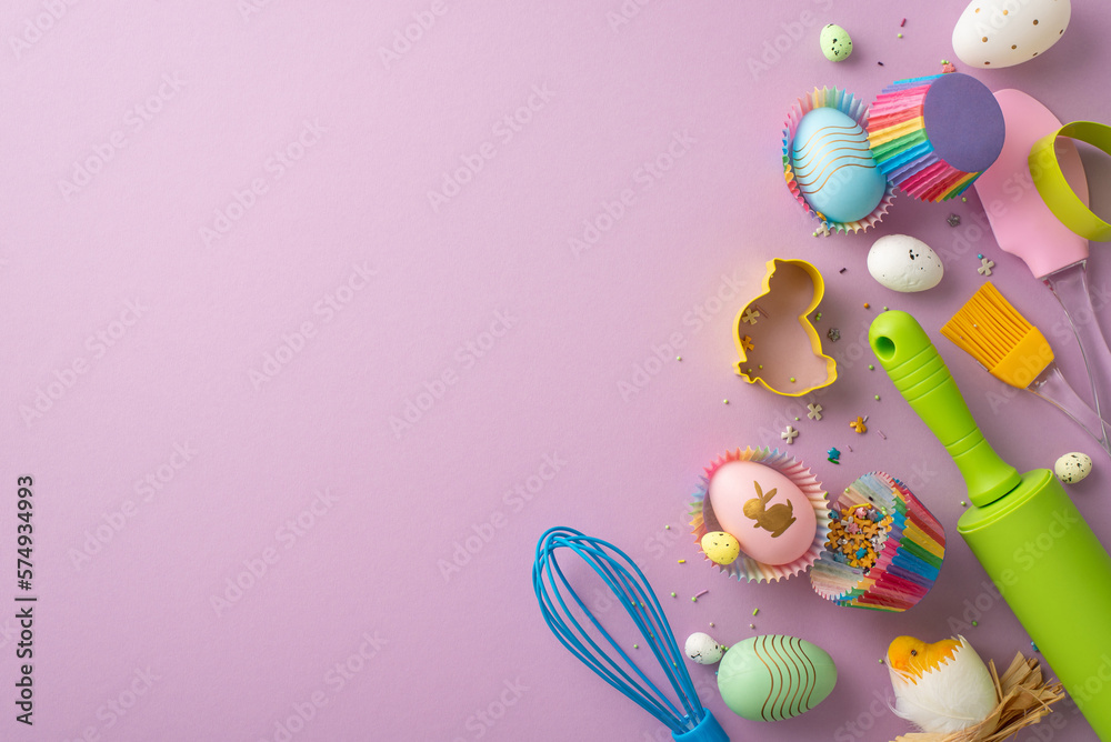 Easter concept. Top view photo of kitchen utensils whisk rolling pin silicone spatula brush colorful easter eggs in paper baking molds chicken and sprinkles on isolated lilac background with copyspace