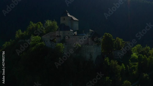 Exterior Of Historic Reifenstein Castle On A Hill In Hamlet Elzenbaum In South Tyrol, Italy. aerial pullback photo