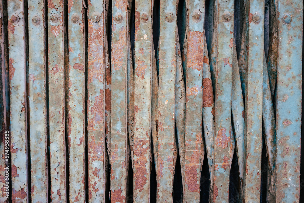 Background of a contracted rusty red blue metal grille. Background of a contracted rusty red blue metal grille.