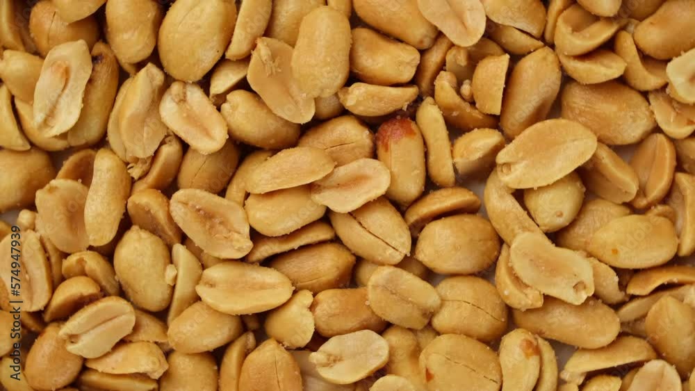 Salted roasted peanuts top view, rotate Salted roasted peanuts top view, rotate