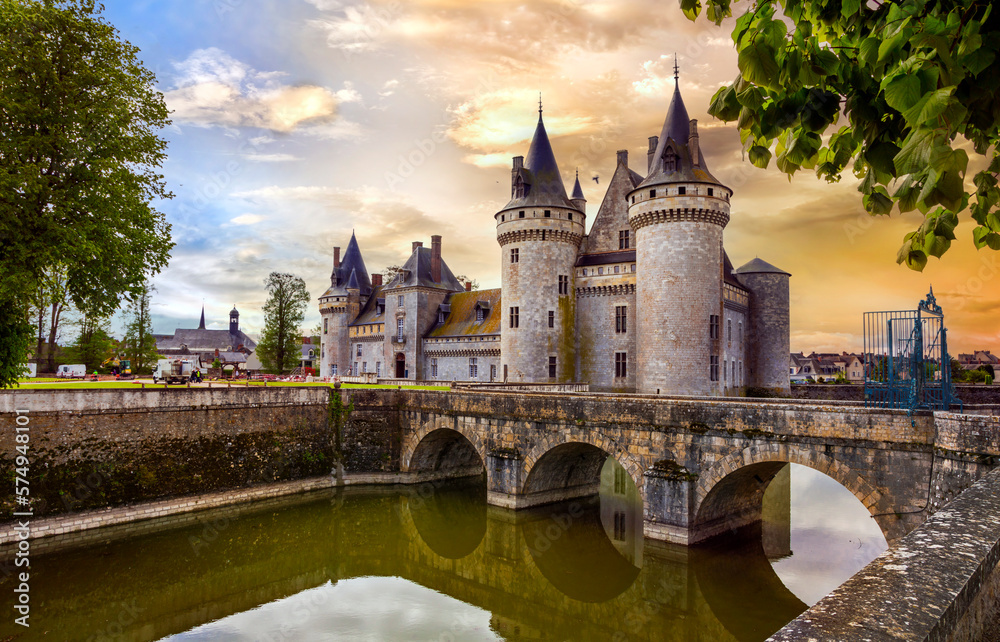 Fototapeta premium great medieval catsles of Loire valley in France. beautiful impressive Sully-sul-Loire over sunset