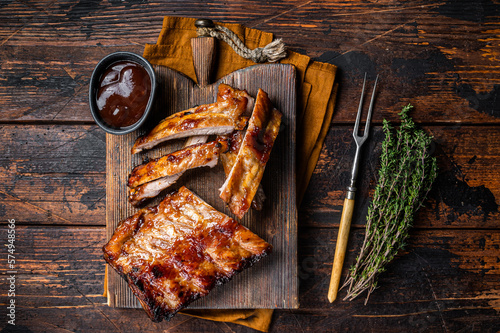 Fotografiet Grilled pork Baby Back spare ribs on a wooden board